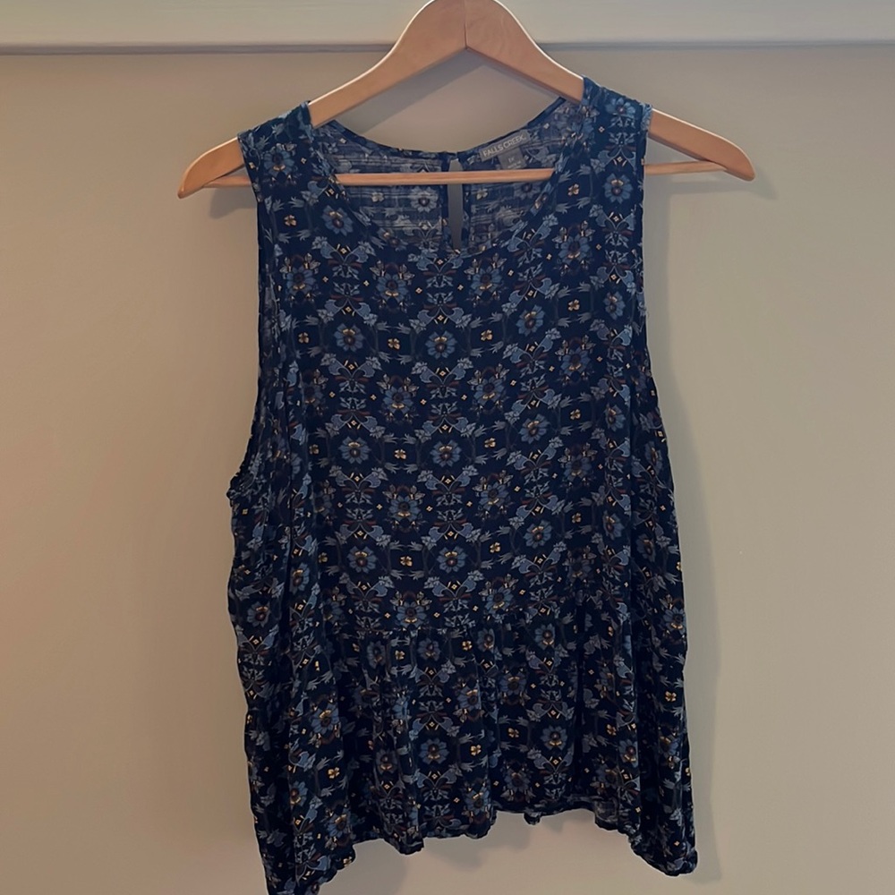 Lightweight, flattering, flowing tank you can dress up or down. Great 4 travel.